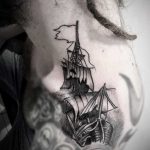 Ship tattoo on the left shoulder