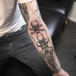 Skull and crossed bones tattoo on the arm