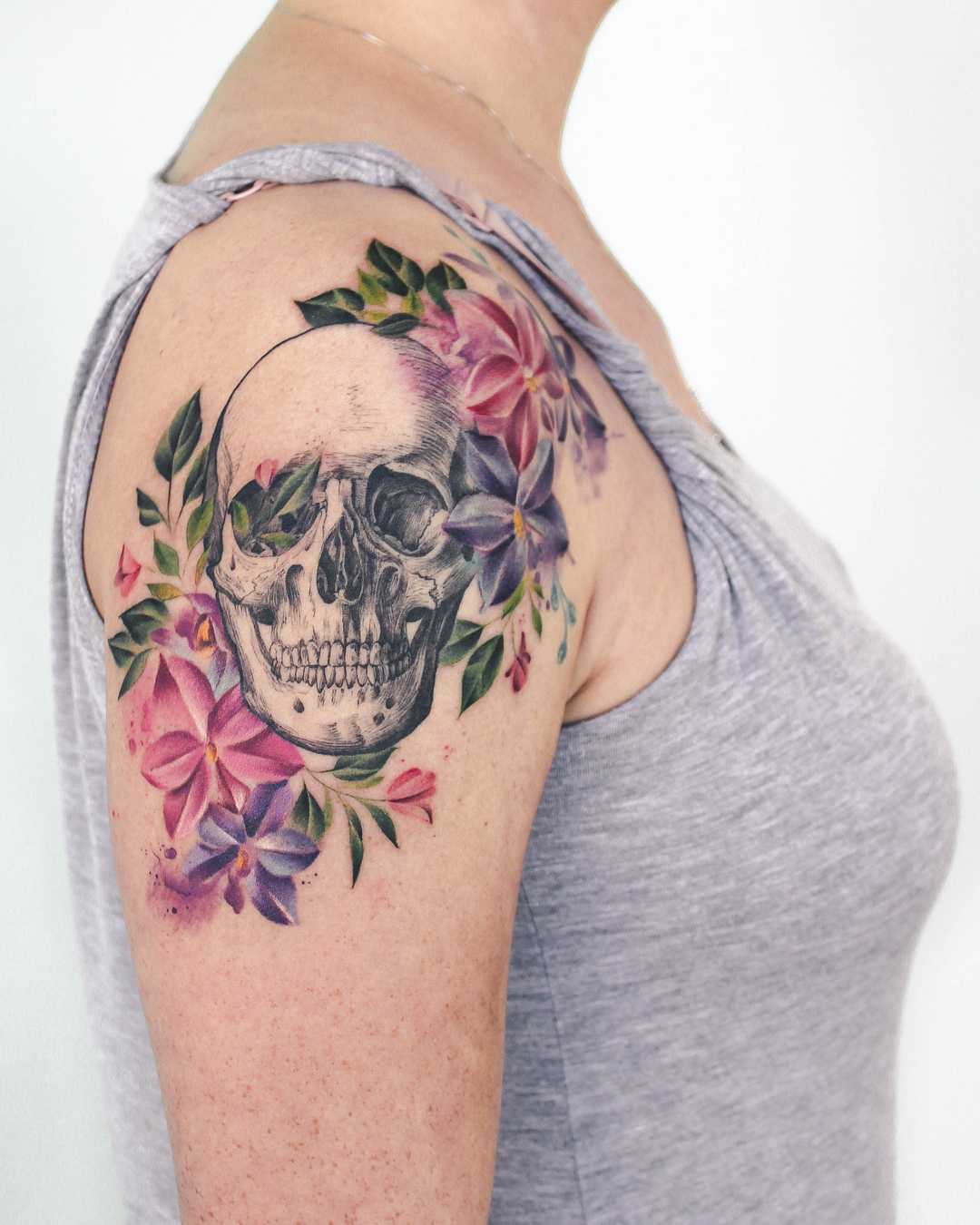Skull and flowers on the right arm