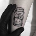 Skull in a jar tattoo