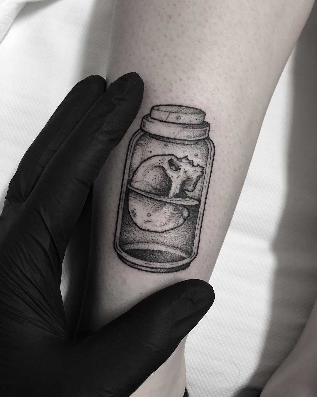 Skull in a jar tattoo