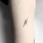 Small lightning bolt by Femme Fatale Tattoo