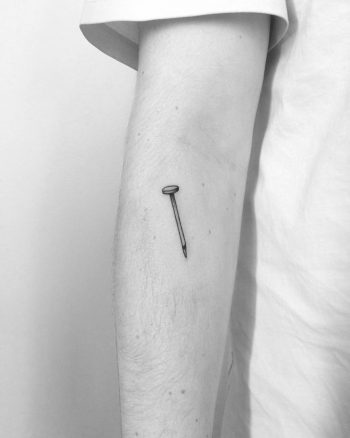 Small nail tattoo