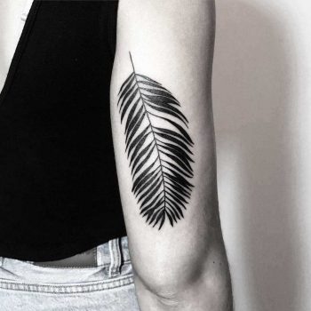 Solid black branch tattoo