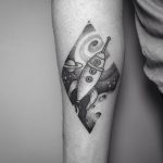 Spaceship tattoo on the forearm