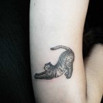 Stretching cat tattoo