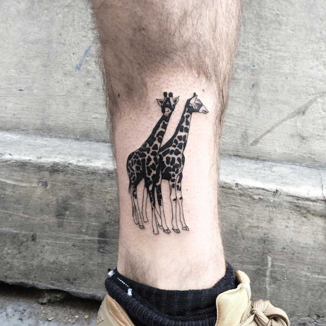 Tattoo of two giraffes