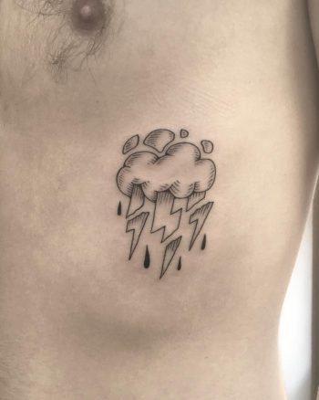 Thunder cloud tattoo on the rib cage