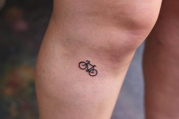 Tiny bicycle tattoo by Yi.postyism