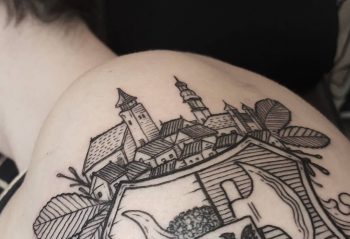 Tiny city tattoo on the shoulder