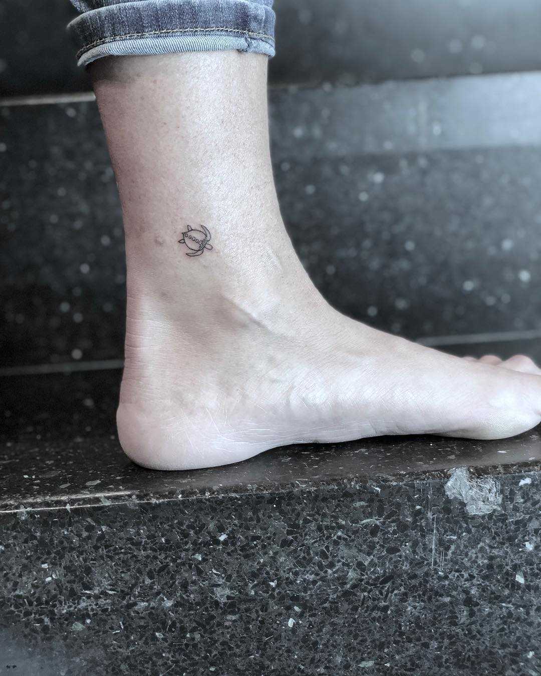 Tiny turtle tattoo on the ankle
