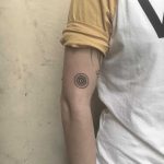 Tiny wheel tattoo