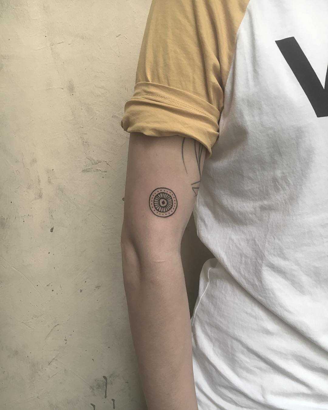 Tiny wheel tattoo
