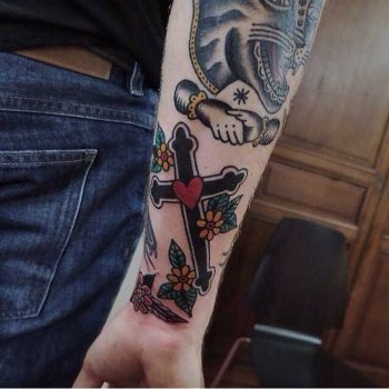 Traditional cross tattoo by Rich Hadley