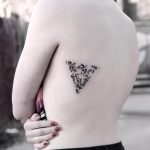 Triangular greenery tattoo by Stella