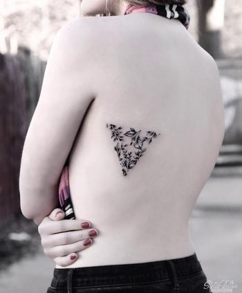 Triangular greenery tattoo by Stella