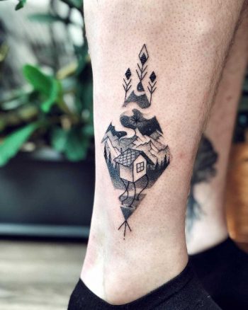 Triangular landscape on the calf by Sasha Tattooing