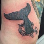 Whale tail tattoo on the thigh