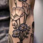 White and blue flower bouquet tattoo