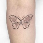 World map butterfly tattoo