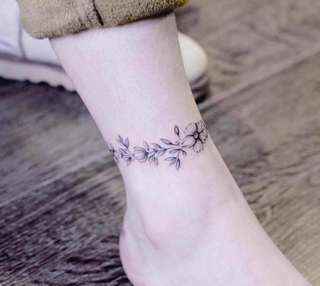 Wrap around floral piece by Helen Xu Tattoo