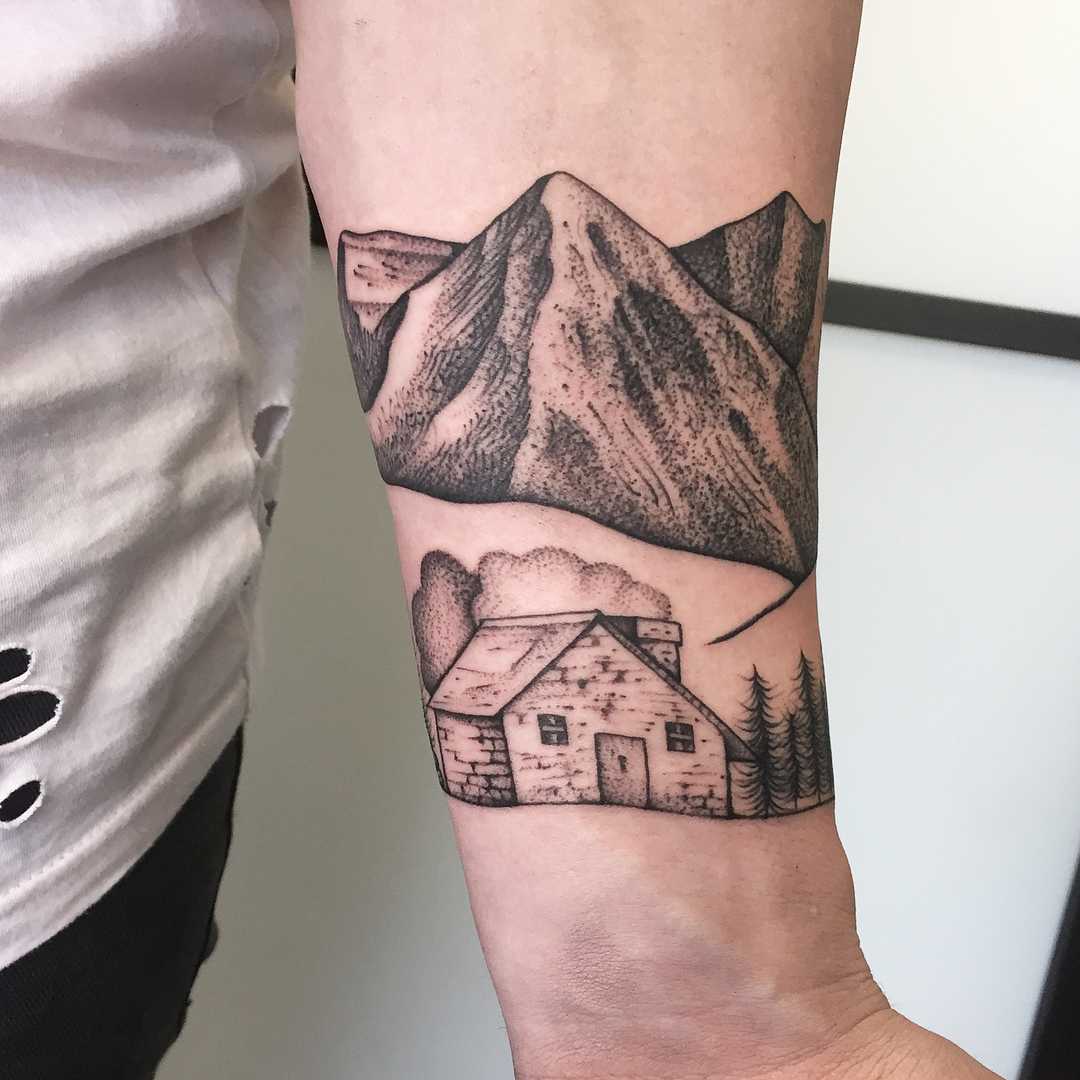 A lonely hut in the mountains tattoo