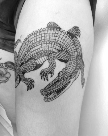Alligator tattoo on the thigh