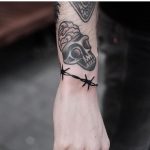 Barbed wire bracelet tattoo by Jonas Ribeiro