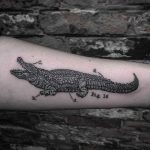Black and grey aligator tattoo