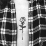 Black and grey rose on the sternum