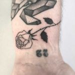 Black rose on the wrist by Femme Fatale Tattoo