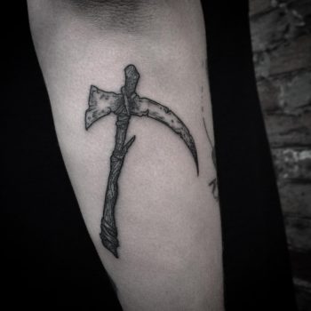 Black scythe tattoo