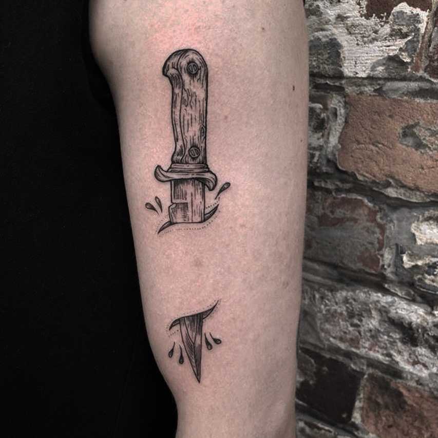 Blackwork dagger on the arm