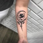 Blackwork rose and moon tattoo