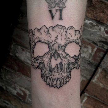 Blackwork skull fragment tattoo