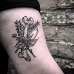 Bone, crystal, and lavender tattoo