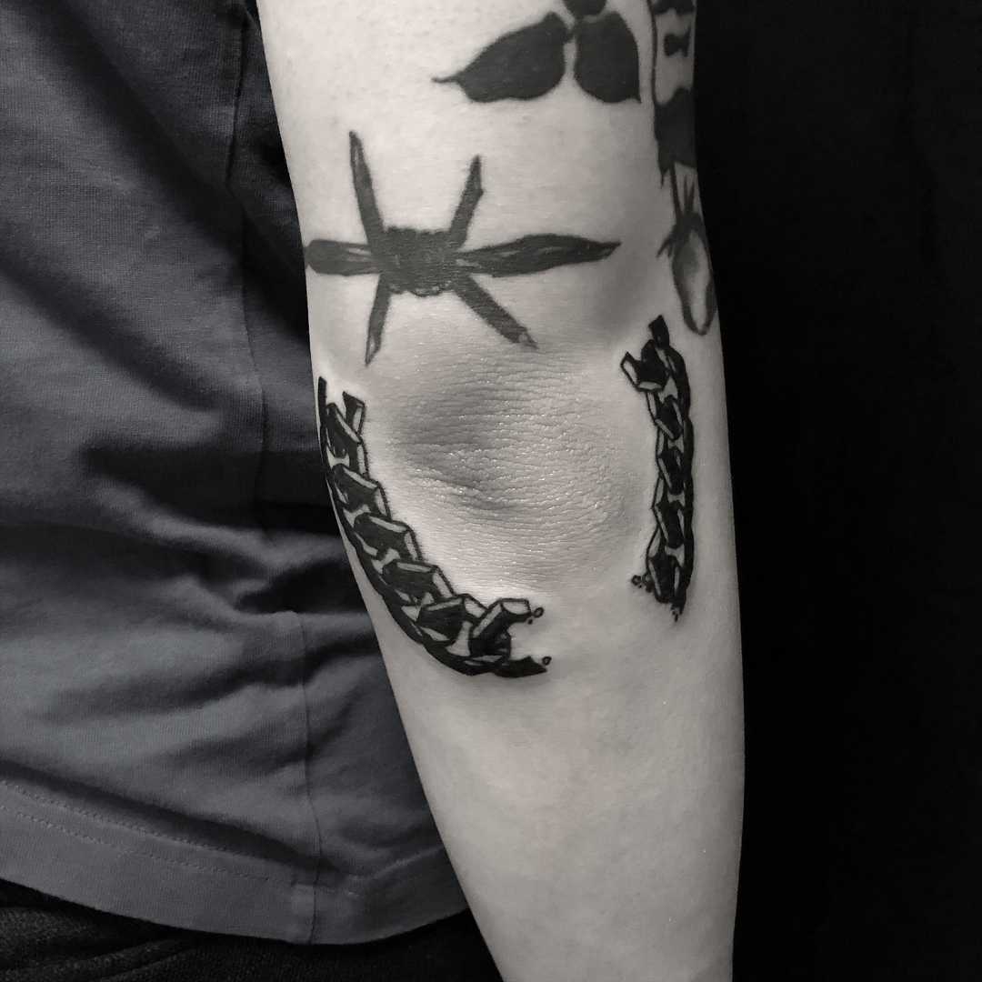 Broken chain tattoo done at BK Ink Studio