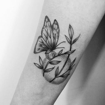Butterfly on a plant tattoo