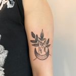 Candle and crescent moon tattoo
