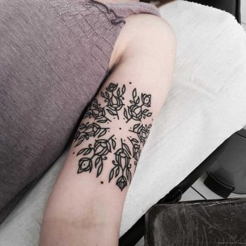 Circular floral pattern tattoo
