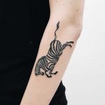 Cool zebra tattoo on the forearm