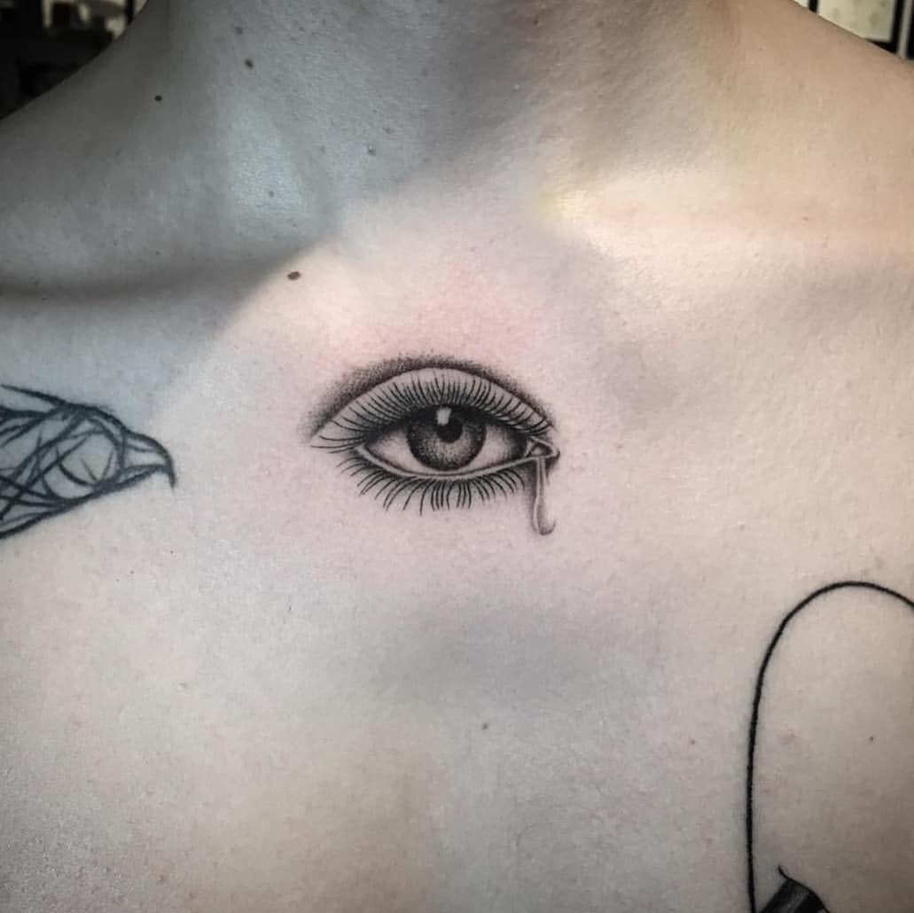 Crying eye tattoo on the chest
