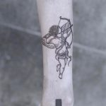 Cupid tattoo by Marvelous Tattooer