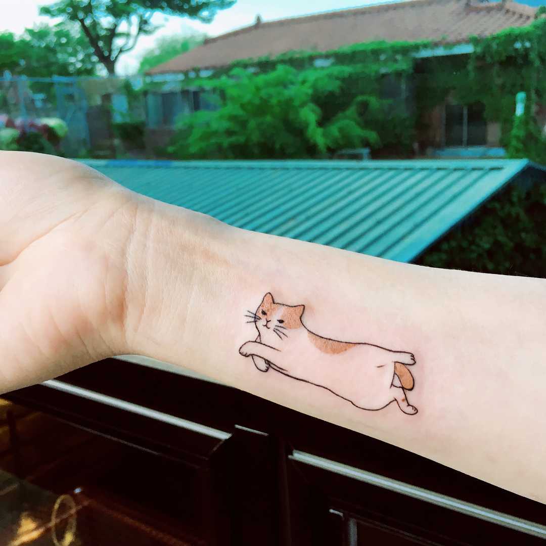 Cute jumping cat tattoo