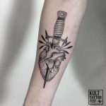 Dagger pierced heart done at Kult Tattoo Fest