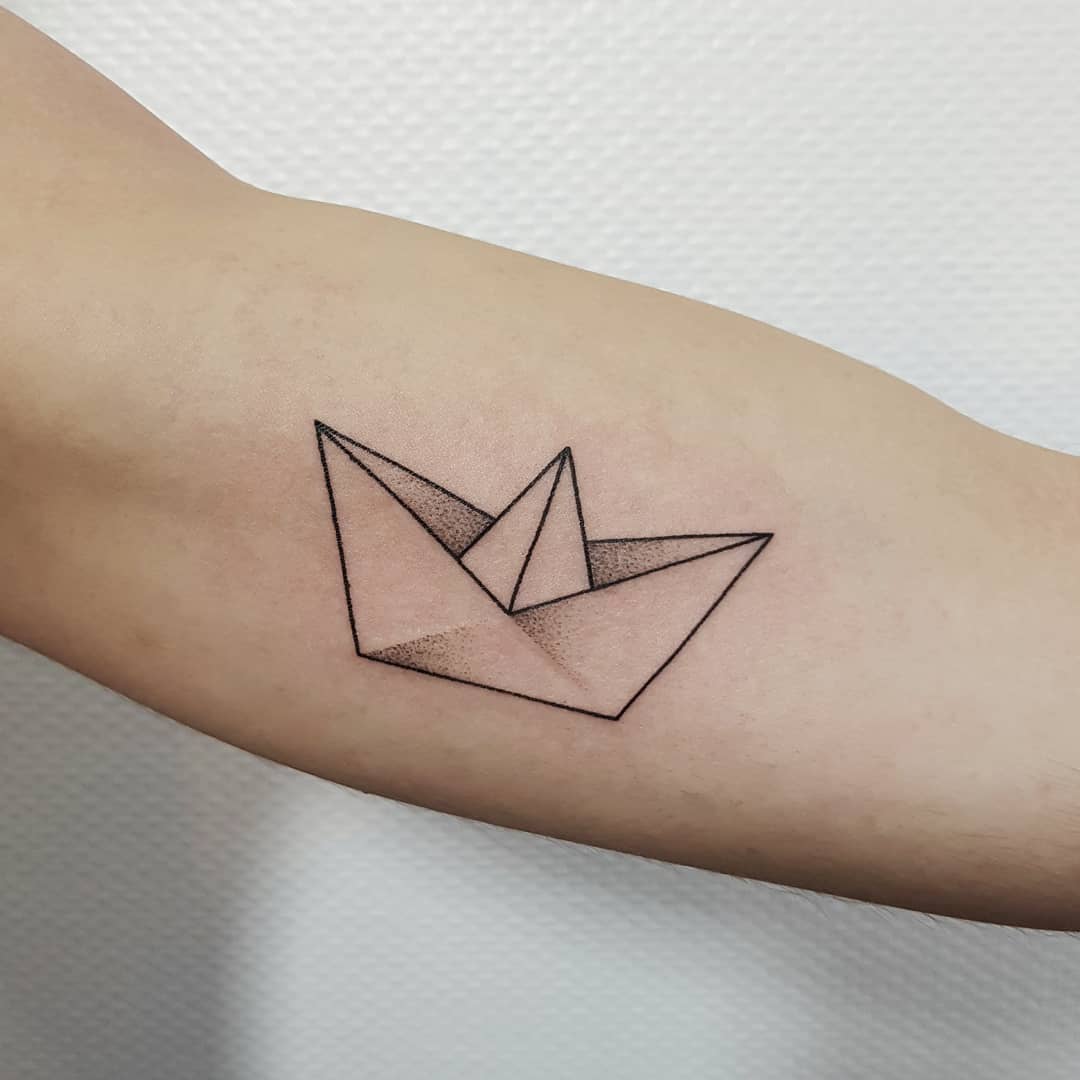 Dot-work paper boat tattoo
