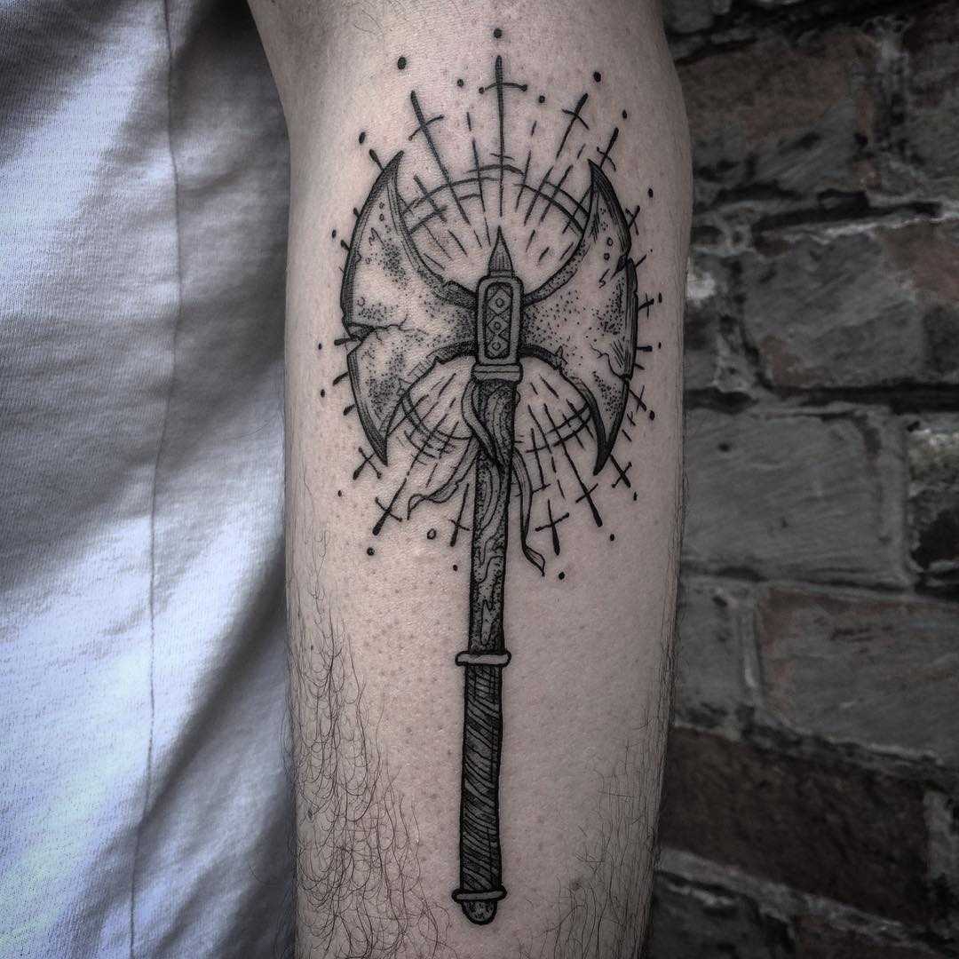 Double axe tattoo on the forearm