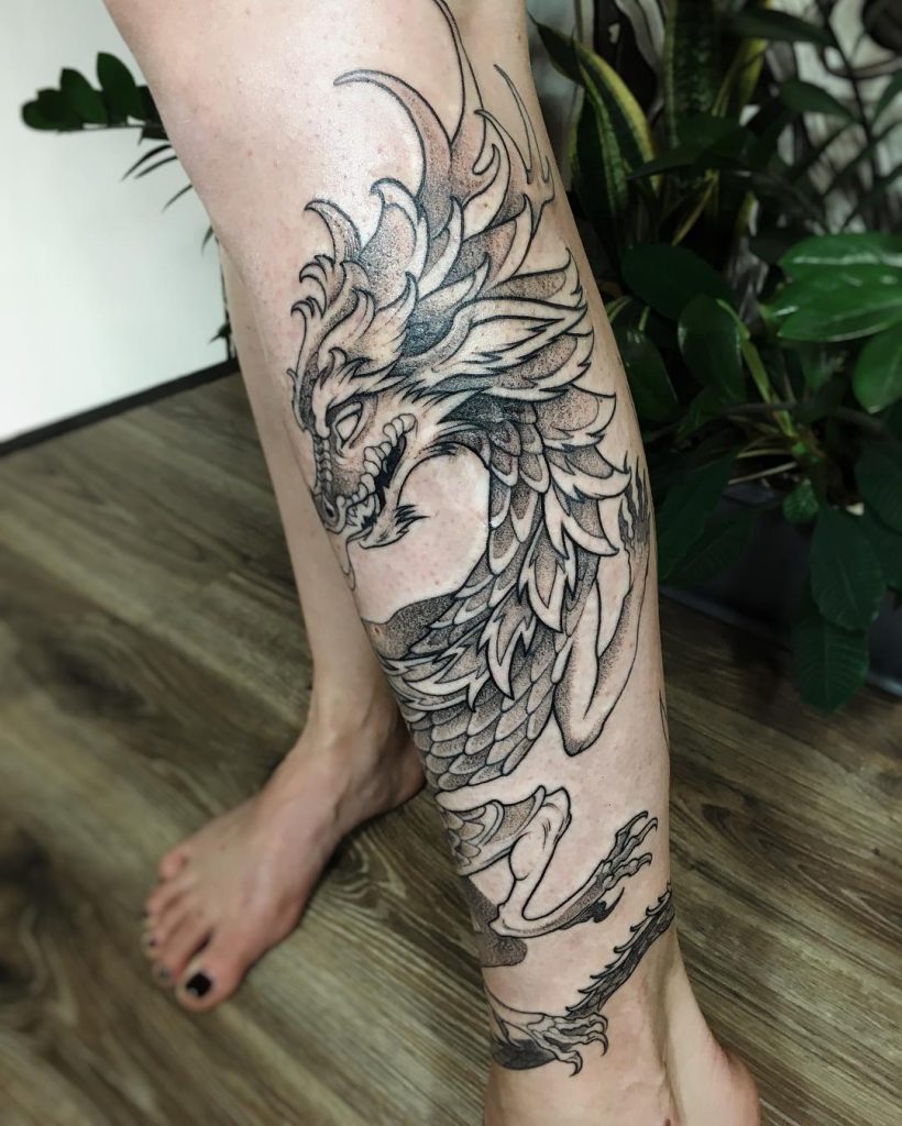 Dragon tattoo on the left calf