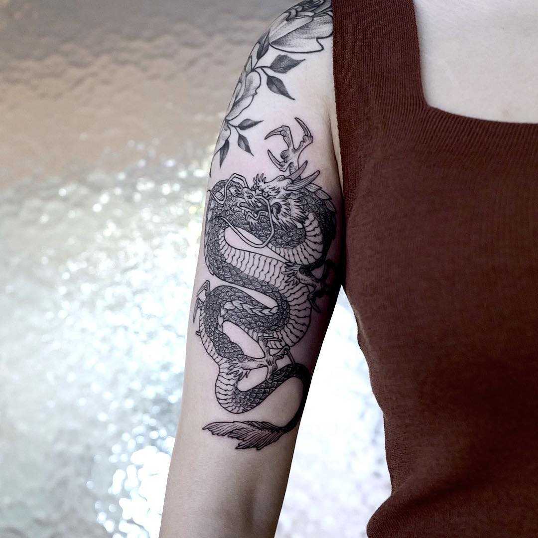 Dragon tattoo on the right arm