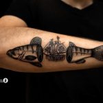 Fish and ship tattoo